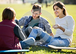 Teenagers hanging out outdoors and discussing something