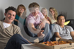 Teenagers Having Fun And Eating Pizza