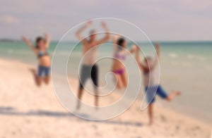 Teenagers Jumping on the Beach