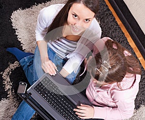 Teenagers with laptop at home