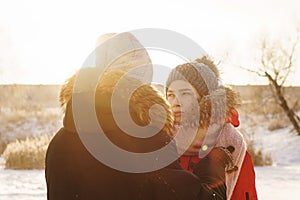 Teenagers in love. Date in winter