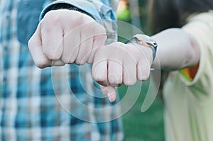 Teenagers making fist bump. Hand gesture