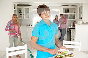 Teenagers not enjoying housework photo