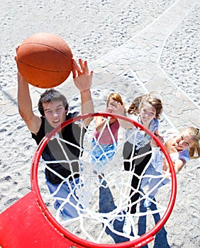 Teenagers playing basketball