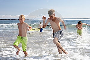 Teenagers playing on beach