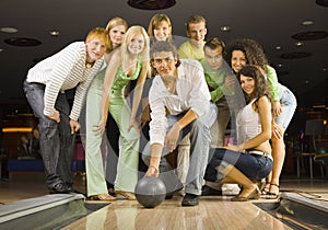 Teenagers playing bowling