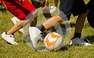 Teenagers playing football