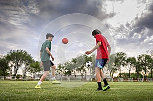 Teenagers playing football on field