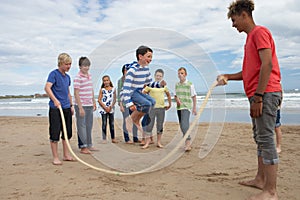 Teenagers playing skipping rope