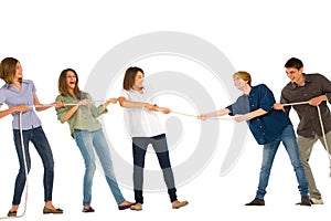 Teenagers playing tug of wa