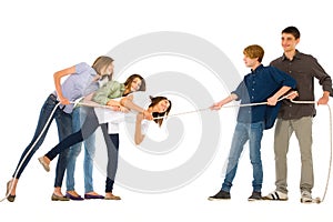 Teenagers playing tug of wa