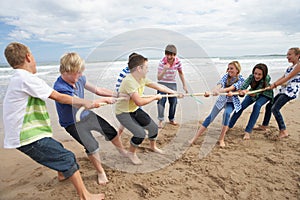 Teenagers playing tug of war