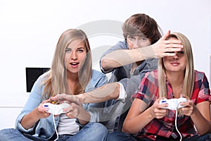 Teenagers playing video games
