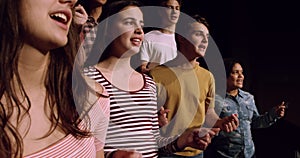 Teenagers rehearsing in a theatre