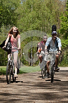 Teenagers riding on bicycles