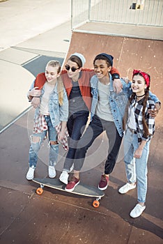 Teenagers spending time at skateboard park