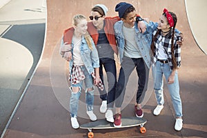 Teenagers spending time at skateboard park