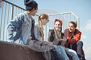 Teenagers spending time at skateboard park