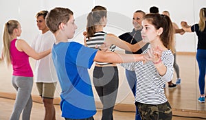 Teenagers studying dancing of partner dance