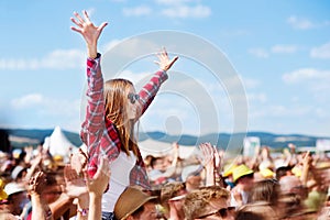 Teenagers at summer music festival enjoying themselves