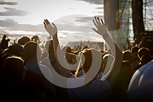 Teenagers at summer music festival enjoying themselves