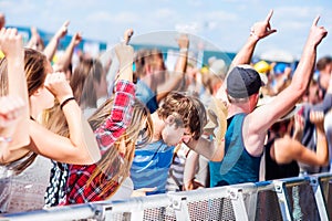 Teenagers at summer music festival having good time