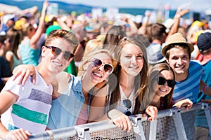 Teenagers at summer music festival having good time