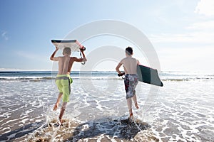 Teenagers surfing