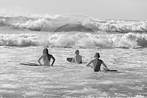 Teenagers Swimming Surfing Waves