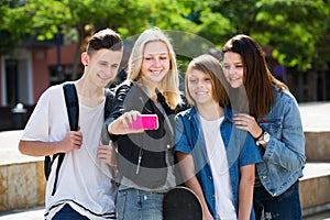 Teenagers taking mobile self picture