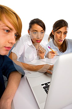 Teenagers using laptop