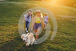 Teenagers walking with dog