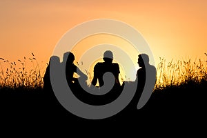 Teenagers watching sunset