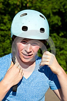 Teenboy with cycle helmet