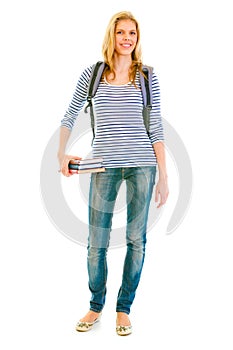 Teengirl with schoolbag holding books in hand