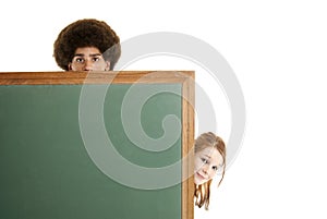 Teens with blank chalkboard