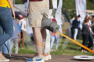 Teens at concert at summer festival. Legs of teenager at summer music festival