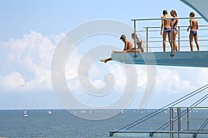 Teens on diving board