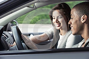 Teens driving car photo