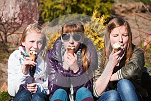 Young girls eating an ice cream