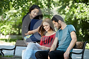 Teens hanging out outside and doing homework