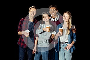 happy group of teens with cups of coffee to go photo