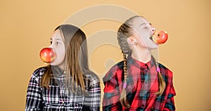 Teens with healthy snack. Cheerful kids having fun and eating apples. We are on healthy diet. Healthy dieting and