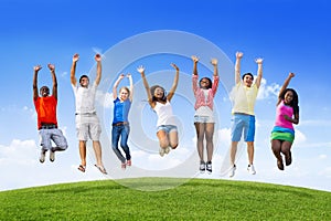 Teens Jumping On a Hill photo