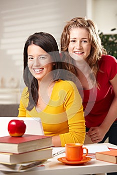 Teens looking at laptop