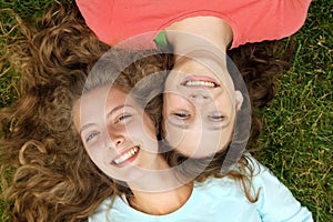 Teens lying in a grass