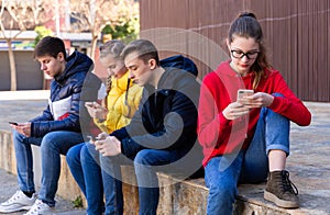 Teens outdoor with smartphones