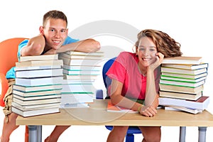 Teens with piles of books