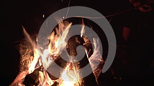 Teens playing with campfire.