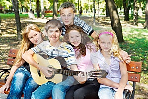 Teens playing guitar